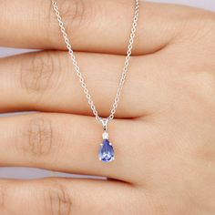 Product Details Experience classic and enduring sophistication with this Solitaire Pendant Necklace that features a Pear Shape Tanzanite gemstone set in 4 Prong Setting with a sparkling Diamond. Suspended from a delicate chain, this Fine Pendant Necklace will make you look out from the crowd. Product Information SKU SHP-PENDANT0821339952 Weight 2.00 gm (Approximate) TANZANITE INFORMATION No.of Stones 1 Pieces Total Weight 0.84 Carat (Approximate) Dimension(approx) Pear-5X7 mm-1 Pcs Color Blue Cu Luxury Tanzanite Teardrop Jewelry, Teardrop Tanzanite Gemstone Jewelry, Elegant Tanzanite Oval Pendant Jewelry, Classic Tanzanite Pendant Jewelry, Tanzanite Gemstone Round Pendant, Solitaire Pendant Necklace, Tanzanite Gemstone, Solitaire Pendant, Drop Pendant