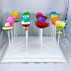 there are many different colored lollipops on sticks