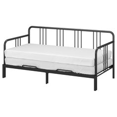 a black metal daybed with white sheets on it's bottom and side rails