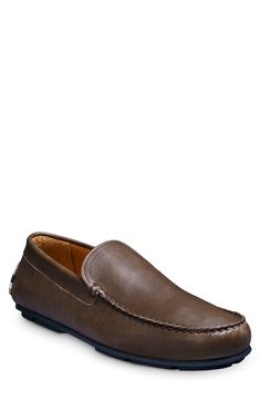 A streamlined silhouette and squared-off moc toe bring timeless sophistication to a leather loafer grounded by a cushioned footbed and rubber driving sole. Cushioned footbed with arch support Leather upper and lining/synthetic sole Imported Slip-on Moc Toe Driving Loafers, Slip-on Moc Toe Loafers For Driving, Modern Brown Moc Toe Moccasins, Moc Toe Driving Loafers With Leather Sole, Classic Moc Toe Driving Moccasins, Moc Toe Moccasins For Driving With Leather Footbed, Business Casual Moc Toe Moccasins With Cushioned Footbed, Cushioned Moc Toe Moccasins For Business Casual, Driving Loafers