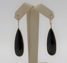 "Beautiful dangle earrings.  Vintage gold handmade earrings with a black onyx stone as a drop. Authentic 14K yellow gold black onyx drop earrings, excellent condition. Earring length: 2.21\" (56.03mm) Earring width: 0.55\" (13.92mm) Earrings weigh: 9.3g Will be placed into a suitable gift box. Free shipping within the U.S." Luxury Black Gemstone Earrings, Black Pierced Earrings In Fine Jewelry Style, Black Pierced Earrings Fine Jewelry, Black Polished Finish Fine Jewelry Earrings, Elegant Black Spinel Jewelry For Evening, Luxury Onyx Drop Earrings, Fine Jewelry 14k Gold Black Earrings, Elegant Black Drop Jewelry, Black Dangle Earrings Fine Jewelry