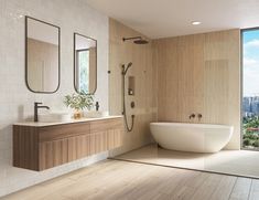 a bathroom with a tub, sink, and large window overlooking the cityscape