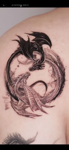 a woman with a dragon tattoo on her back