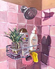 a potted plant sitting on top of a shelf next to a shower faucet