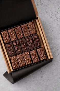 a box filled with chocolates sitting on top of a table