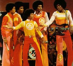 the jacksons performing on stage in their seventies fashion outfits, circa's or early'80s