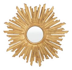 a gold sunburst shaped mirror on a white background