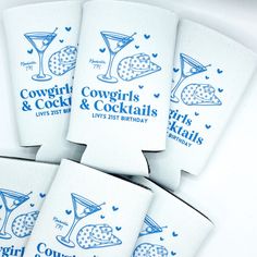 six white coasters with blue lettering and images of cocktail glasses on them, sitting next to each other