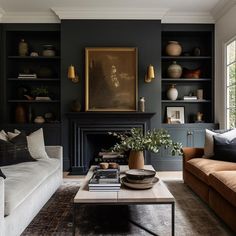 a living room with two couches and a coffee table in front of a fireplace