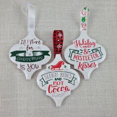 three christmas ornament ornaments on a table