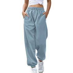 Women High Waisted Sweatpants Joggers Drawstring Athletic Pants With Pockets are the ideal fusion of fashion and coziness. These functional pants are made to move with you, giving you unrestricted freedom to run, jump, and stretch. They are suitable for the entire day because of the smooth, breathable fabric. These jogger pants are a stylish statement that can be dressed up or down thanks to their striking hues and modern style. Specifications: Fabric Type: Cotton, polyester Care Instructions: Baggy Full-length Drawstring Sweatpants, Baggy Solid Color Leisure Bottoms, Baggy Drawstring Pants For Winter, Baggy Leisure Bottoms, Trendy Baggy Joggers With Drawstring, Winter Baggy Pants With Drawstring, Solid Color Sportswear Bottoms With Drawstring, Solid Sportswear Bottoms With Drawstring, Leisure Harem Pants With Pockets