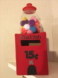 a gummy machine filled with lots of colorful balls