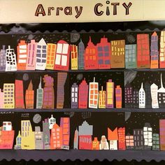 an array of city buildings are on display in a bookcase with the words array city written above them