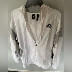 Adidas White 90’s Raincoat. Never Worn Adidas Windbreaker With Pockets For Spring, White Adidas Windbreaker For Spring, Adidas Spring Windbreaker With Pockets, Adidas White Outerwear For Spring, White Adidas Outerwear For Spring, White Adidas Windbreaker For Fall, Adidas Long Sleeve Windbreaker For Fall, Adidas White Windbreaker For Fall, Adidas White Outerwear For Fall