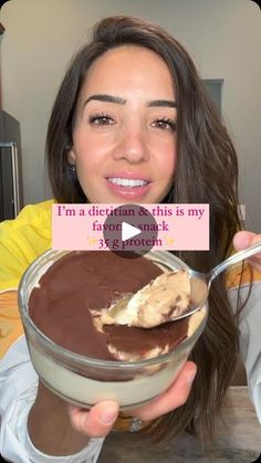 a woman is holding a bowl of chocolate pudding with a spoon in her hand and the caption says, i'm a diet this is my favorite