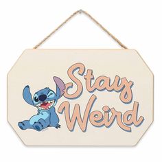 a wooden sign that says stay weird with an image of stitch - stitch stitch stitch stitch stitch