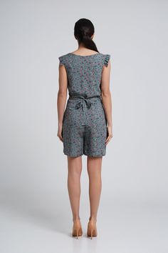 "A lightweight short summer romper feturing v-neckline, short ruffled sleeves and a shift silhouette. - V neck - short ruffled sleeves - shift silhouette - front button closure - two pockets in side seams - fabric belt - mini length (above the knee) - flower print Fiber: 100 % viscose Color: dark green For Size S (06 US): length - 34\" (87 cm) You may feel free choosing the size. Just send us your measurements (bust, waist, hips, height)." Casual Summer Jumpsuits And Rompers With Ruffles, Casual Floral Print V-neck Jumpsuits And Rompers, Summer Jumpsuit With V-neck And Ruffles, Summer V-neck Ruffles Jumpsuits And Rompers, Summer Jumpsuit With Ruffles And V-neck, Summer V-neck Jumpsuit With Ruffles, Casual Ruffled V-neck Jumpsuits And Rompers, Summer Jumpsuits And Rompers With Tie Waist, V-neck Ruffled Jumpsuits And Rompers For Beach