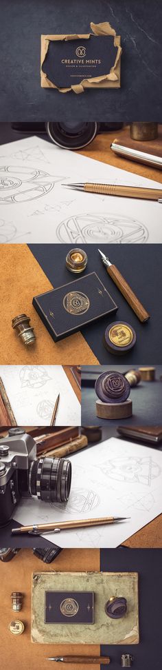 several different types of pens and pencils sitting on top of a wooden table next to papers