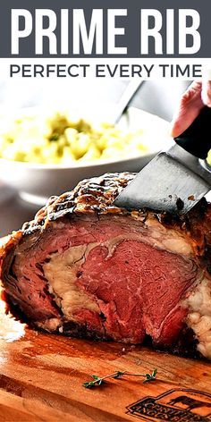 a large piece of meat is being sliced on a cutting board