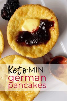 two mini muffins with butter and jam on top