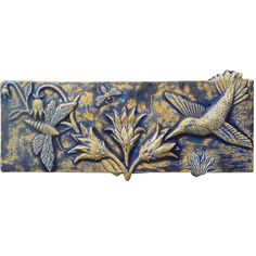 a decorative wall panel with two birds and flowers on the bottom, painted in blue and gold