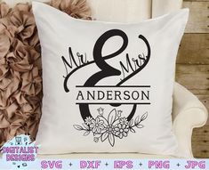 a white pillow with the words mr and mrs on it next to a flower arrangement