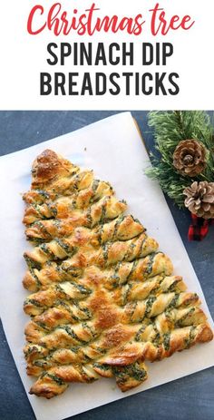 christmas tree spinach dip breadsticks on a cutting board next to pine cones