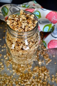 a glass jar filled with oats on top of a table