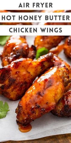 grilled chicken wings on a white plate with text overlay that reads, air fryer hot honey butter chicken wings