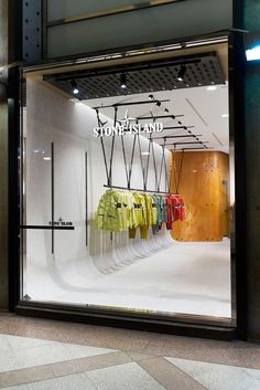 a store window with clothes on display in it