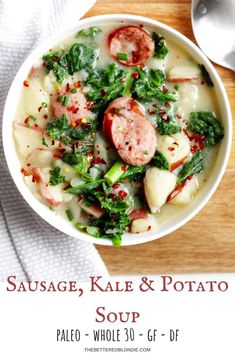 sausage, kale and potato soup is served in a white bowl on a wooden table