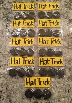 some stickers that say hat trick and have been placed on top of each other