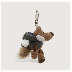 a small stuffed animal hanging from a key chain