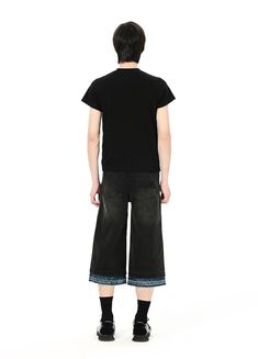 Versatile Double Waist Denim Capris - Embrace style and comfort with our unisex, 100% denim cotton capris. Designed with a unique double waist structure, contrast hems, ripped detailing, and IN TERRIS embroidery and leather patch. Perfect for any occasion. Available in Small, Medium, and Large sizes. Check our detailed size chart for precise measurements: SIZE (CM) LENGTH WAIST BUTT SMALL 80 74 92 MEDIUM 82 82 100 LARGE 83 86 104 Casual Black Cropped Jeans With Frayed Hem, Black Cotton Cropped Jeans, Summer Cropped Capri Jeans In Cotton, Casual Black Cropped Cotton Jeans, Knee-length Cotton Bottoms With Frayed Hem, Casual Knee-length Cropped Denim Jeans, Cotton Capri Length Jeans For Summer, Dark Wash Cotton Knee-length Jeans Shorts, Dark Wash Knee-length Cotton Jeans Shorts