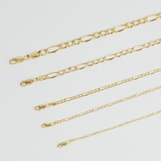 Description: Indulge in timeless elegance with our exquisite Gold Figaro Chain Necklace. Crafted with precision and passion, this stunning piece is a celebration of classic style and modern sophistication. Key Features: 🌟 Luxurious Gold Finish: Our Figaro Chain Necklace is bathed in a lustrous layer of 14k gold, radiating a warm and opulent glow. The gold finish ensures lasting beauty and durability. 🌟 Versatile Length: This necklace is designed for versatility. With an adjustable length of [insert length], it can be worn alone as a statement piece or layered with other necklaces for a trendy, personalized look. 🌟 Figaro Link Design: The Figaro link design is a timeless favorite, characterized by its pattern of three smaller links followed by one elongated link. This classic design adds Rope Chain Gold, Gold Figaro Chain, Figaro Necklace, Figaro Chain Necklace, Link Design, Gold Rope Chains, Figaro Chain, Figaro Chains, Chain Gold