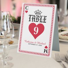 a table set up with place cards and silverware