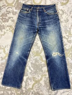 33x30 Blue Distressed Vintage Levi's 506 Jeans Denim JN 683 Size: 33 Actual measurement (inches): Waist - 33 Front Rise - 11.5 Hips - 44 Thigh - 12.5 Knee - 9.5 Leg Opening - 18 Inseam - 30 Outseam - 40.5 Material : Cotton  *Disclaimer: Product color may slightly vary due to photographic lighting sources or your monitor settings.  #JN683 Levis 506, Faded Denim, Grunge Style, Photographic Lighting, Vintage Levis, Denim Blue, Jeans Denim, Vintage Denim, Distressed Denim