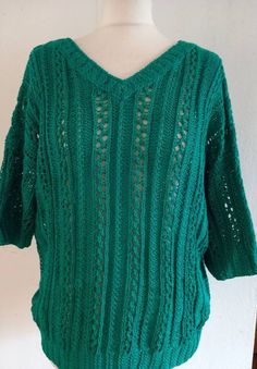 "Great condition hand knit jumper  No labelling but yarn feels like cotton or cotton mix in emerald green Short sleeved Front and back V shaped neckline Actual measurements in inches  Measurements taken relaxed  Back neck width 8.5\" Across shoulder 24\" Armhole circ 15\" Sleeve length 8\" Sleeve opening 7\" Chest 40\" Waist 38\" Hem 35\" Length from side neck point to hem 26\" To see more vintage follow www.etsy.com/shop/skinnyrib" Green Knit V-neck Sweater, Green Knitted Top For Winter, Green V-neck Knit Top For Winter, Green Pointelle Knit Sweater, Green Open Knit Crochet Top For Fall, Fall Green Open Knit Crochet Top, Green Stretch Knitted Sweater, Green Pointelle Knit Winter Top, Green Open Knit Crew Neck Top