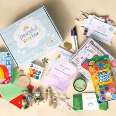 the contents of a play box are laid out on top of each other, including crayons and markers