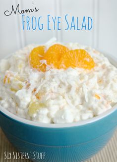 a blue bowl filled with rice and orange slices