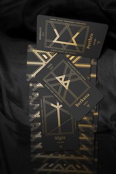 Black and Gold aesthetic rune oracle tarot cards from The Grid of Fortune Rune Oracle Deck. Witch and Magic inspiration. Viking and Norse magical cards with Runes from the Elder Futhark Oracle Decks, Norse Mythology