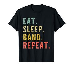 a black t - shirt with the words eat sleep band repeat written in multicolored letters