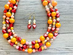 💞One of a kind & ready to ship💞  Dress up any outfit - great for a night out or with a white tee! 16 Inch Necklace with a 4 inch extender chain and gold lobster clasp. This is an eclectic necklace made from orange, yellow, and pink acrylic beads. A total conversation starter!  Thank you for supporting American small business! *Smoke and pet free home!* I ship 6 days a week! This particular necklace one of a kind and is READY TO SHIP!  Thank you for browsing my store! Beaded Jewelry Summer, Woman On Fire, Eclectic Necklace, Orange Necklace, 16 Inch Necklace, Acrylic Jewelry, Jaune Orange, Jewelry Summer, Necklace Chunky