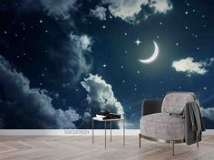 the night sky with stars and crescent moon wallpaper mural in a living room setting