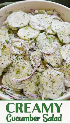 a bowl filled with cucumber salad on top of a table