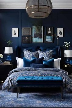 a bedroom with blue walls and furniture