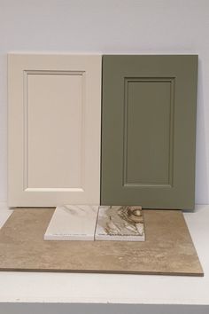 three different colors of cabinet doors sitting on top of a counter next to each other