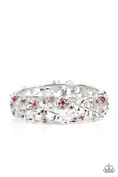 Dotted with dainty pink rhinestone centers, flowering leafy silver vines bloom into two oversized silver frames that delicately hinge into a versatile bangle-like bracelet. Features a hinged closure.

Sold as one individual bracelet. Purple Bracelet, Floral Bracelet, Silver Frames, Purple Rhinestone, Hinged Bracelet, Paparazzi Accessories, Pink Gemstones, Paparazzi Jewelry, Pink Rhinestones