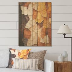 a living room with a white couch and wooden paneling on the wall behind it