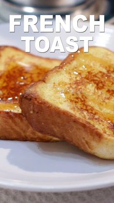 two pieces of french toast on a white plate with the words french toast over it